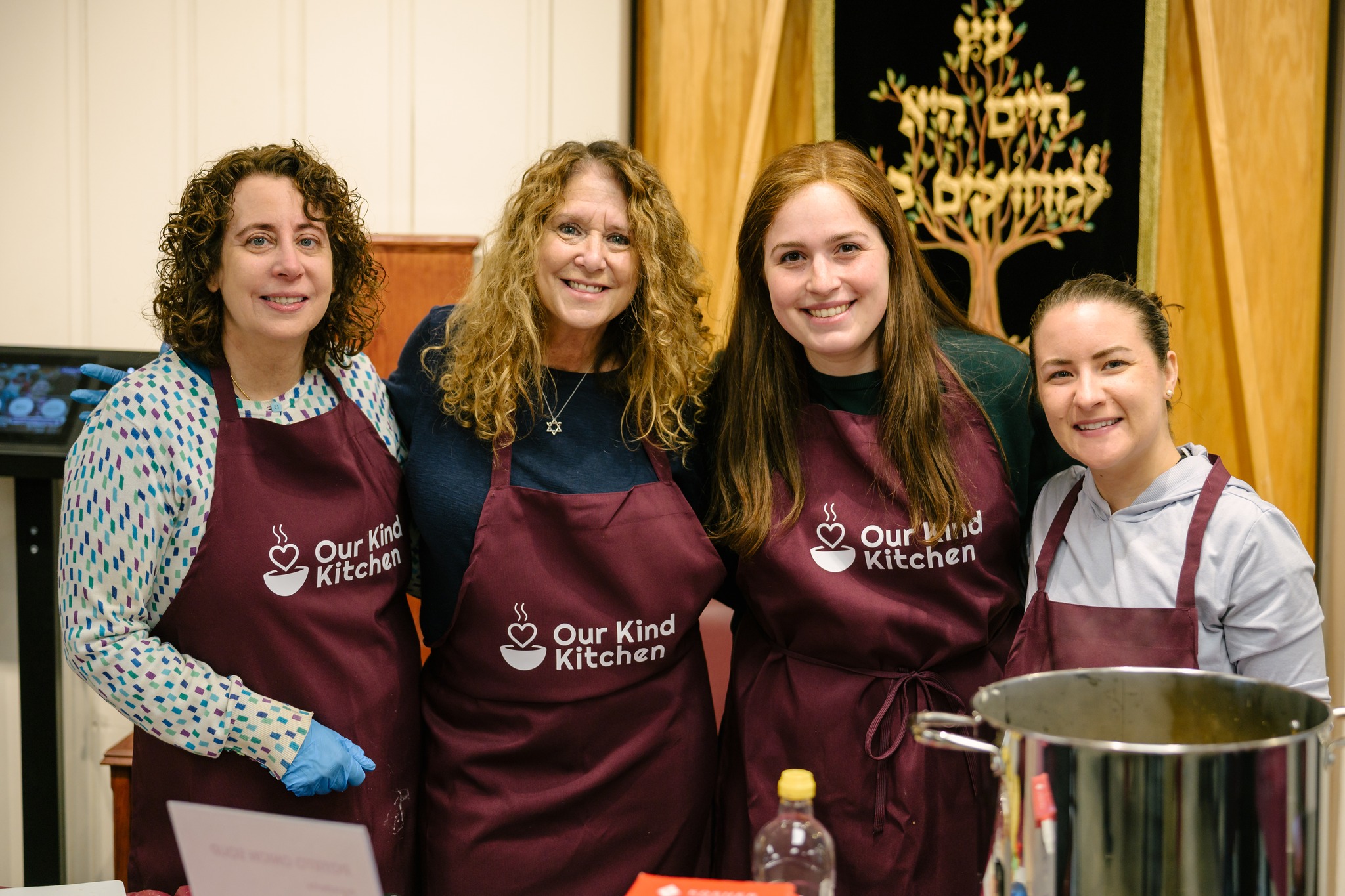 Volunteers working side by side at the prep table